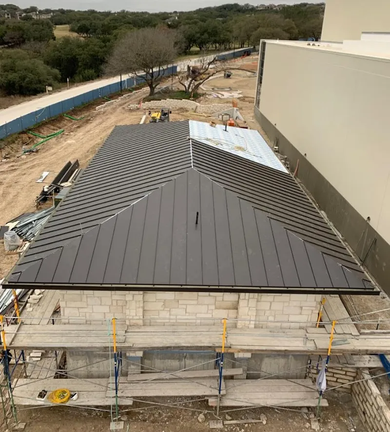 Metal roof new construction with scaffolding in Palmyra