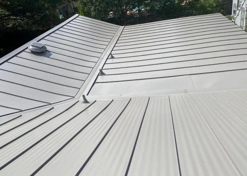 Solar attic fan installed on a metal roof for Roof Ventilation in Palmyra